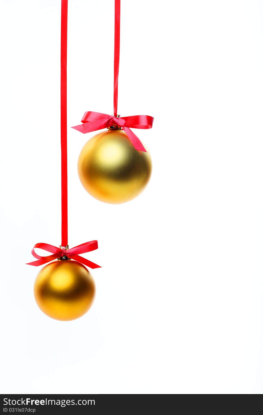 Christmas balls hanging with ribbons on white background