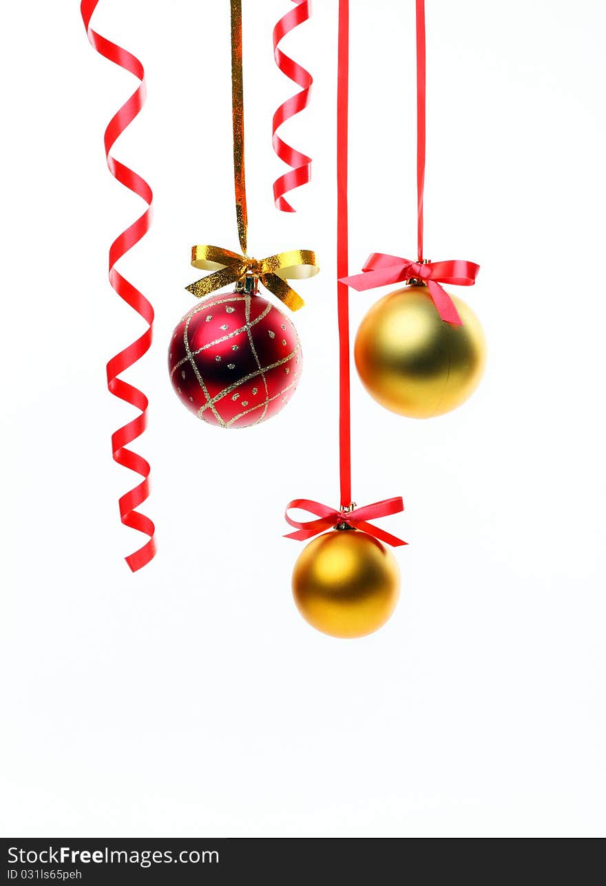 Christmas balls hanging with ribbons on white background