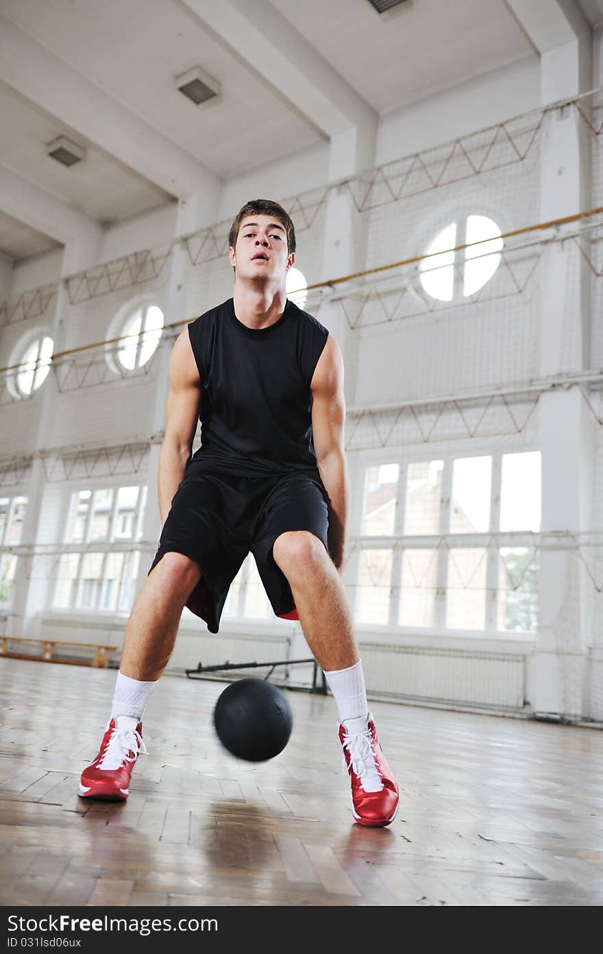 Young and healthy people man have recreation and training exercise while play basketball game at sport gym indoor hall. Young and healthy people man have recreation and training exercise while play basketball game at sport gym indoor hall