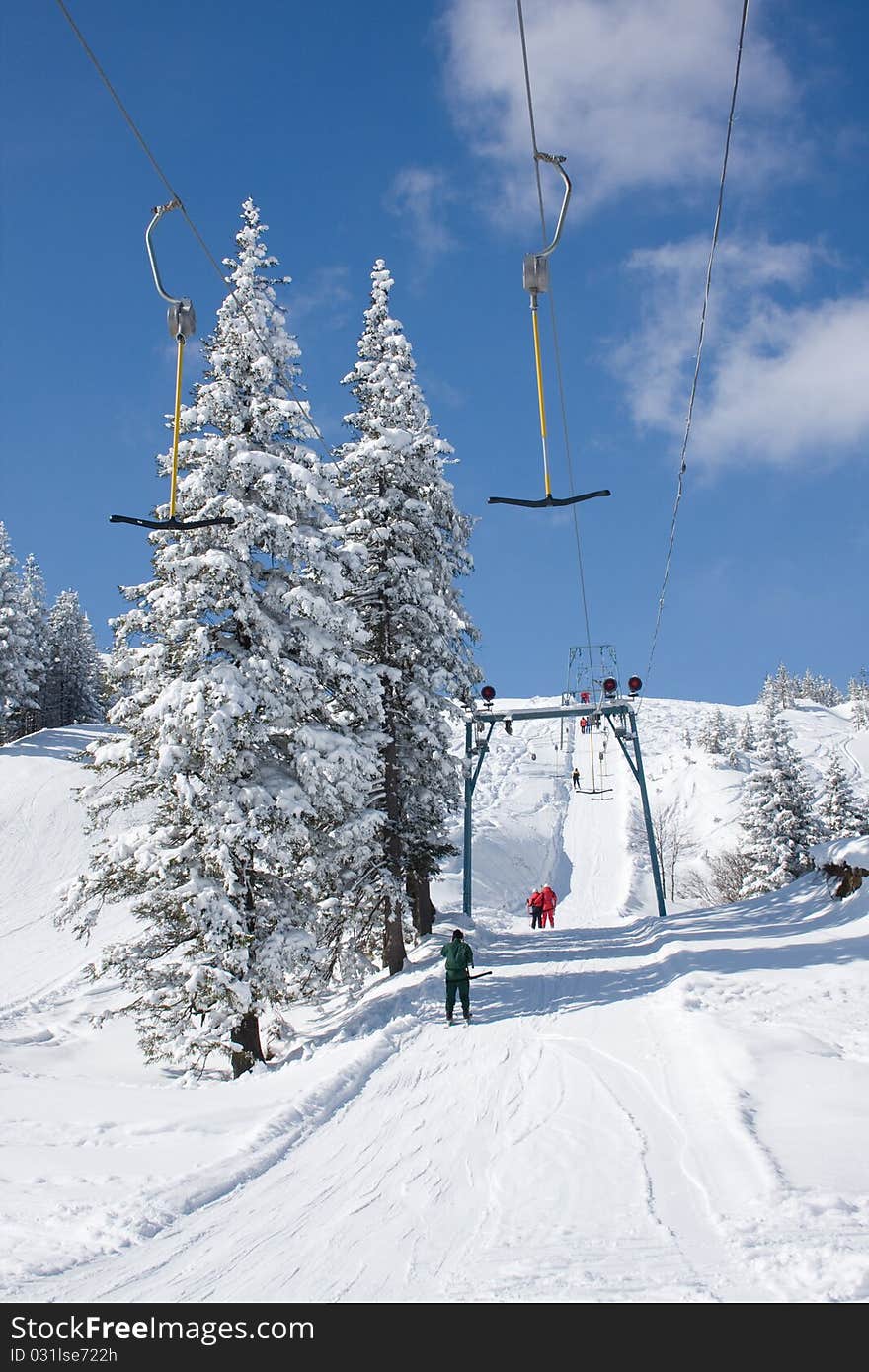 People walk up a mountain on a Surface lift, Ukraine, Dragobrat, Carpathian Mountains