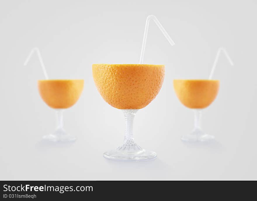 Glass look orange fruit with straw. Glass look orange fruit with straw