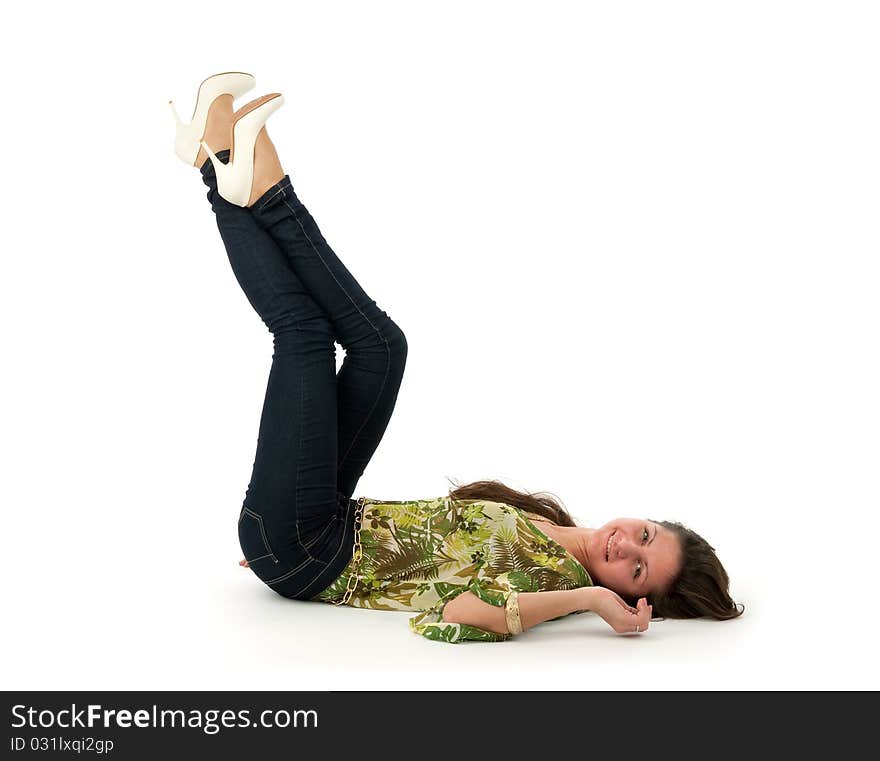 Beautiful woman lying on the floor isolated over a white background