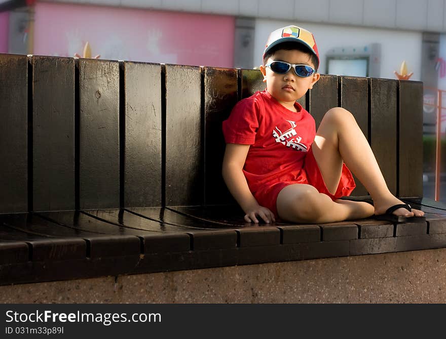 A boy wearing red shirt. A boy wearing red shirt.