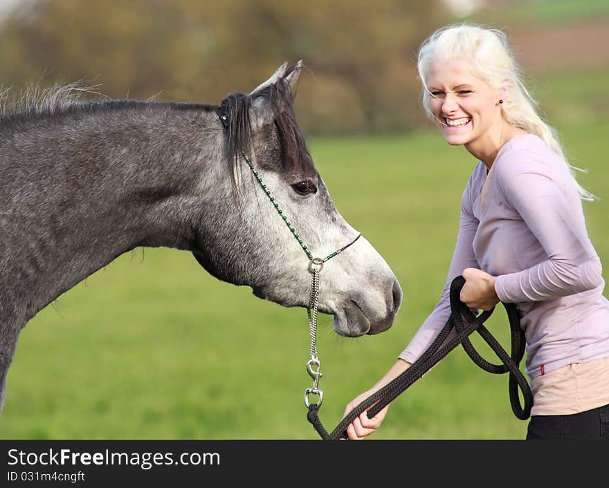 German beaty has really fun with her young Arabian mare. German beaty has really fun with her young Arabian mare