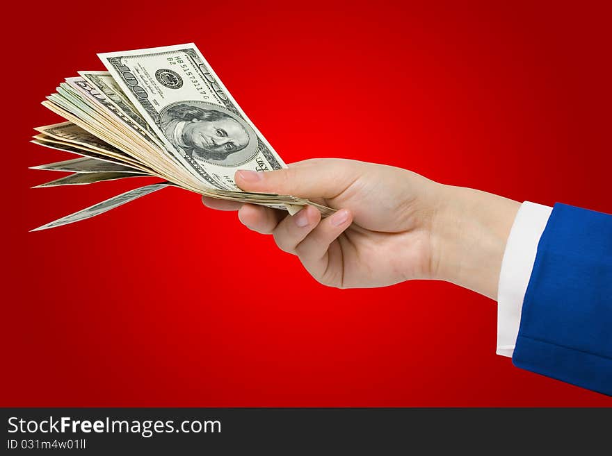 Dollars in hand on a red background + Clipping Path