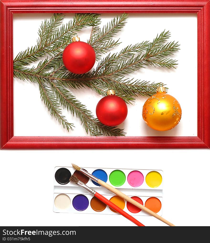 Christmas balls in wood frame on white background