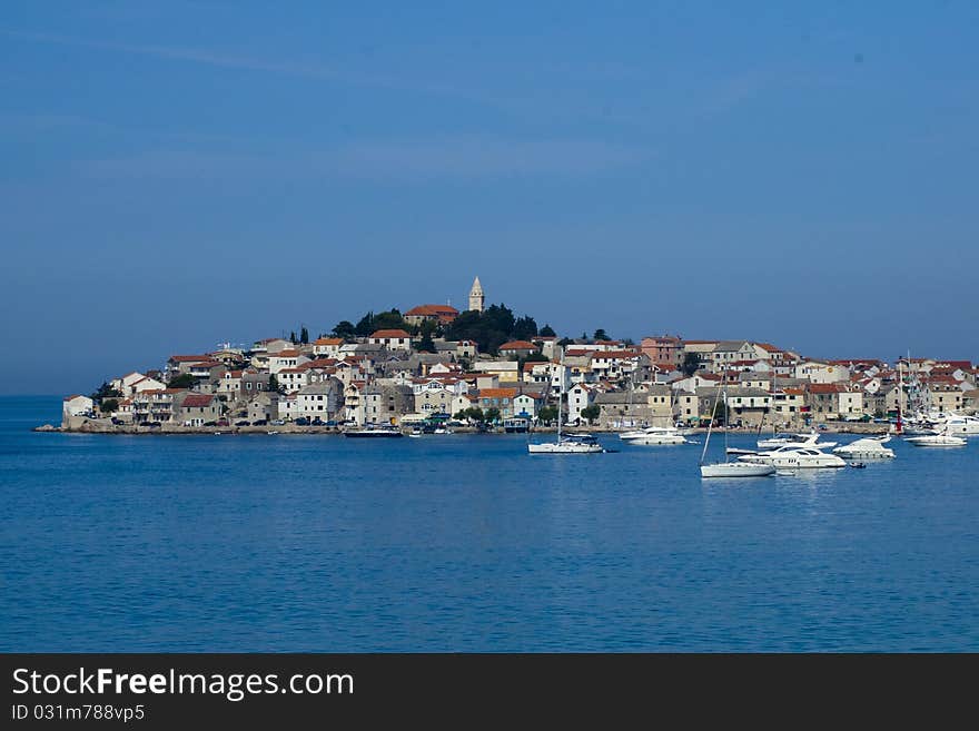 Croatian town, colorful houses and ships