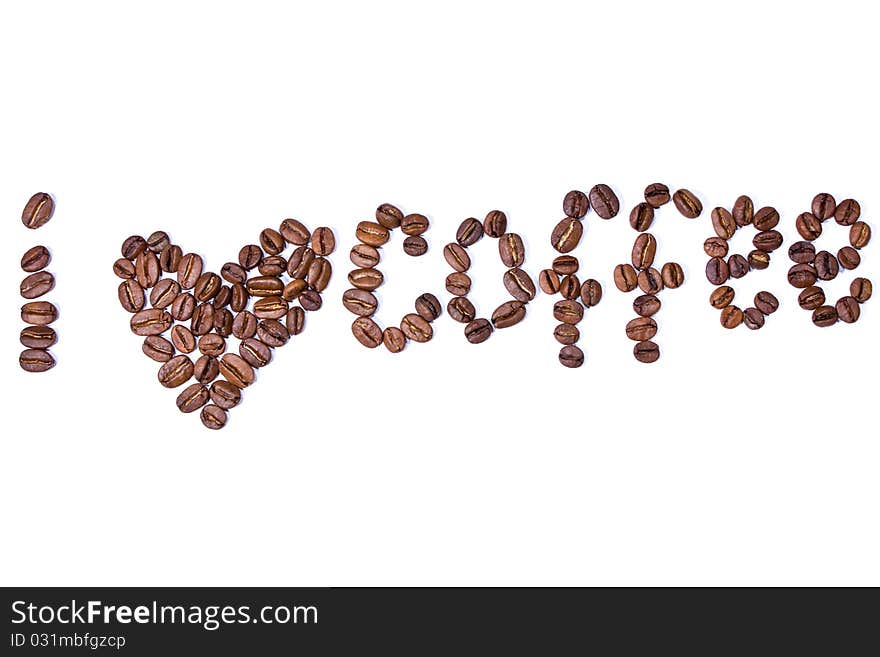 From coffee grains the word and an image of heart is laid out