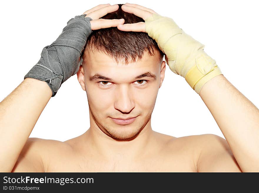 Man in the boxer bandages is held for the head