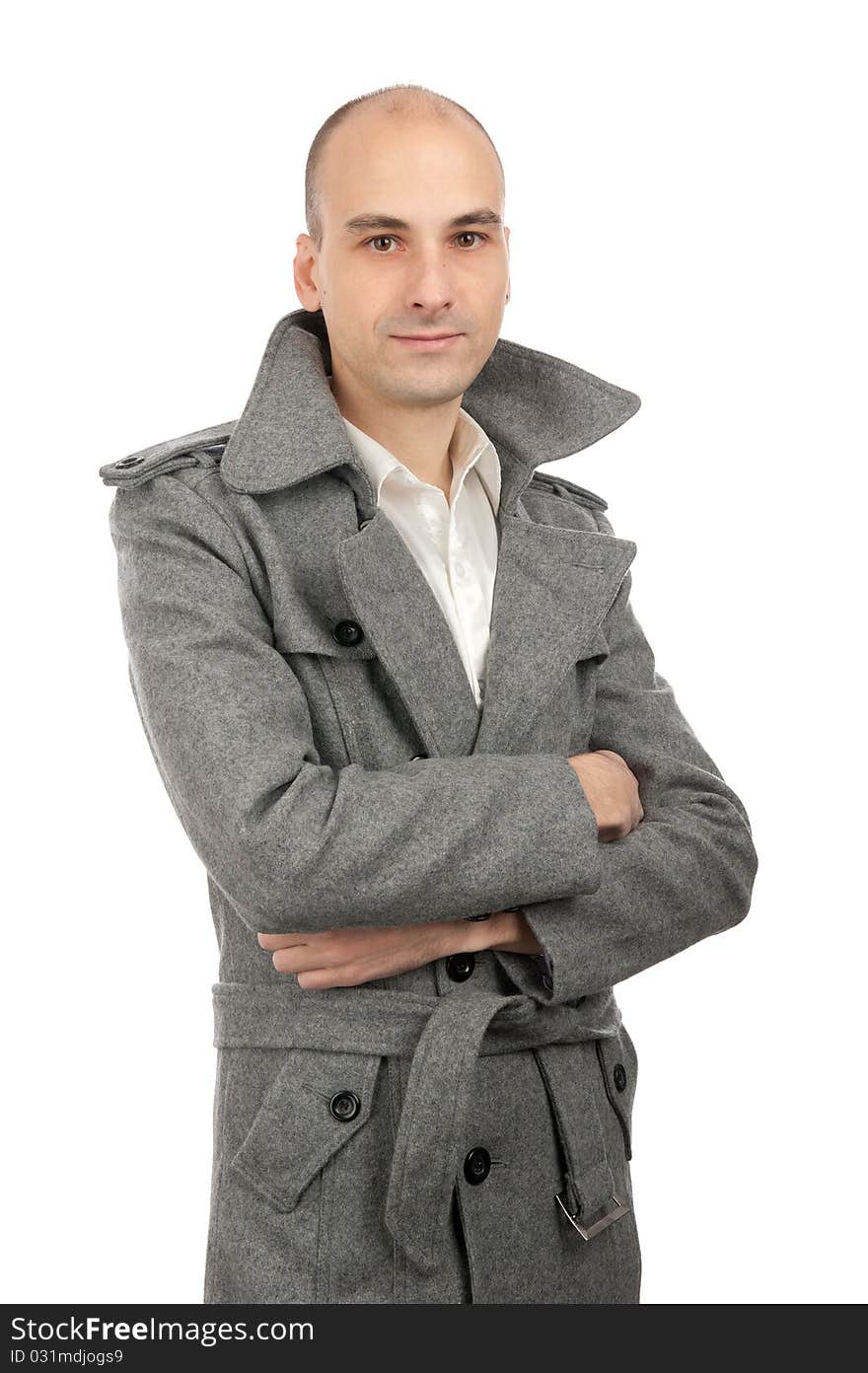 Portrait of handsome man in a coat. Isolated on white background