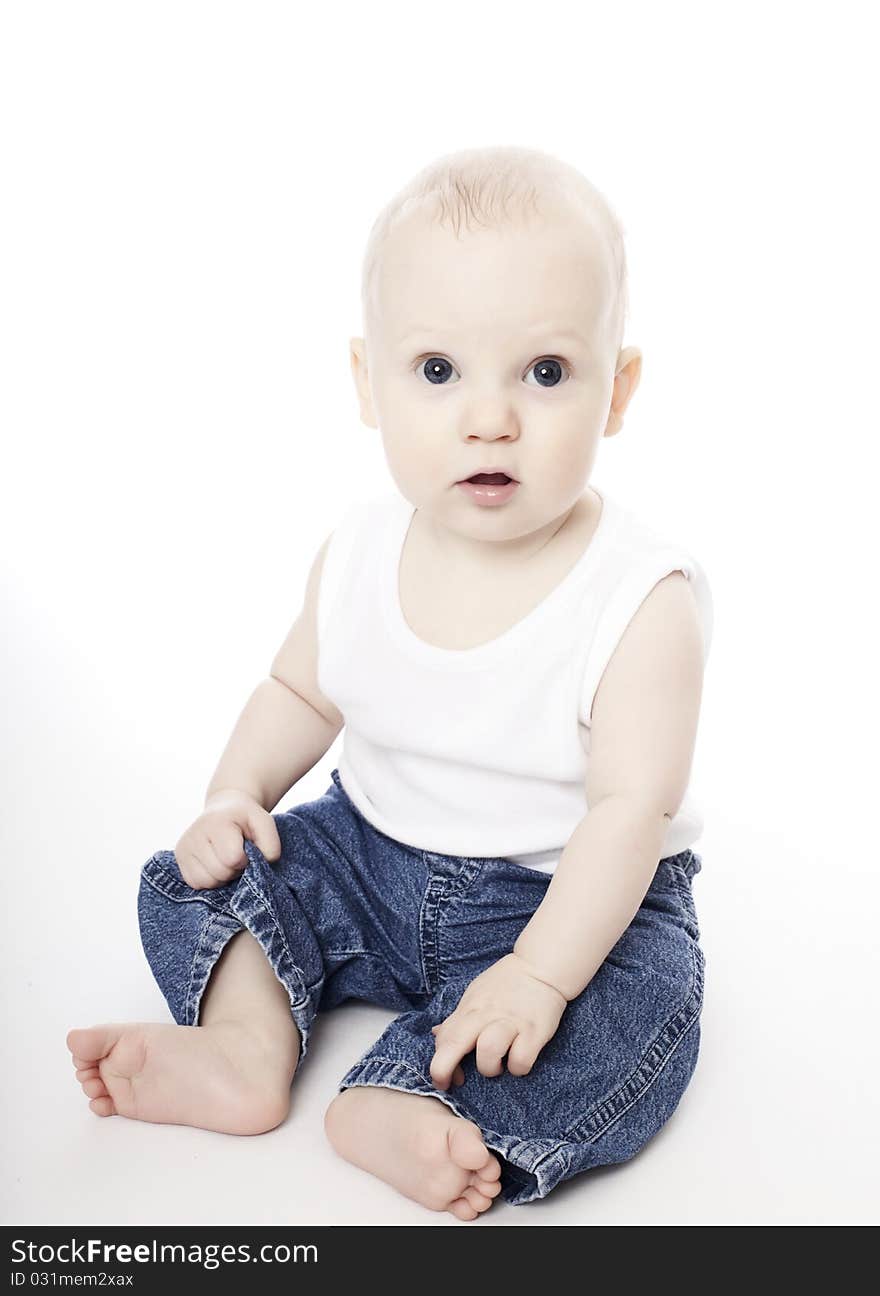 Cute baby boy in white vest