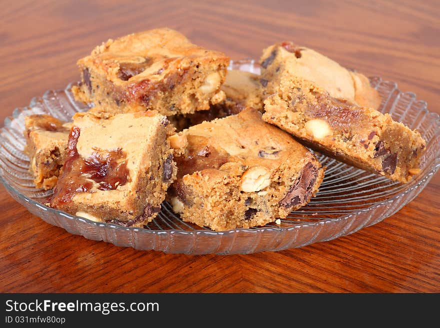 Pieces of peanut butter fudge on a glass plate