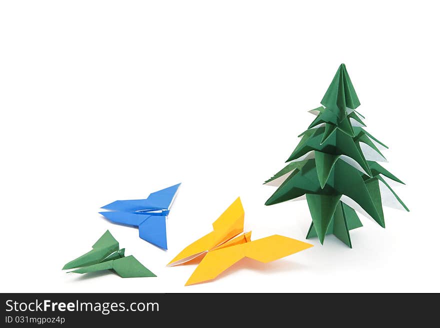 Traditional Japanese origami Christmas tree with butterflies isolated on white