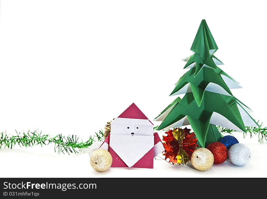 Traditional Japanese origami Christmas tree with Santa isolated on white