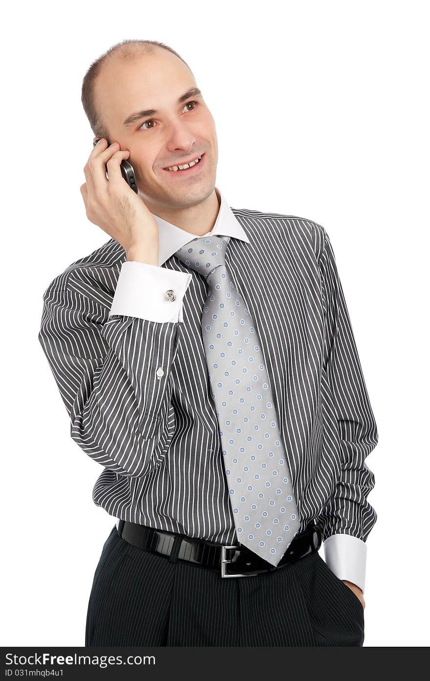 Portrait of young businessman talking on mobile phone. Isolated on white. Portrait of young businessman talking on mobile phone. Isolated on white.