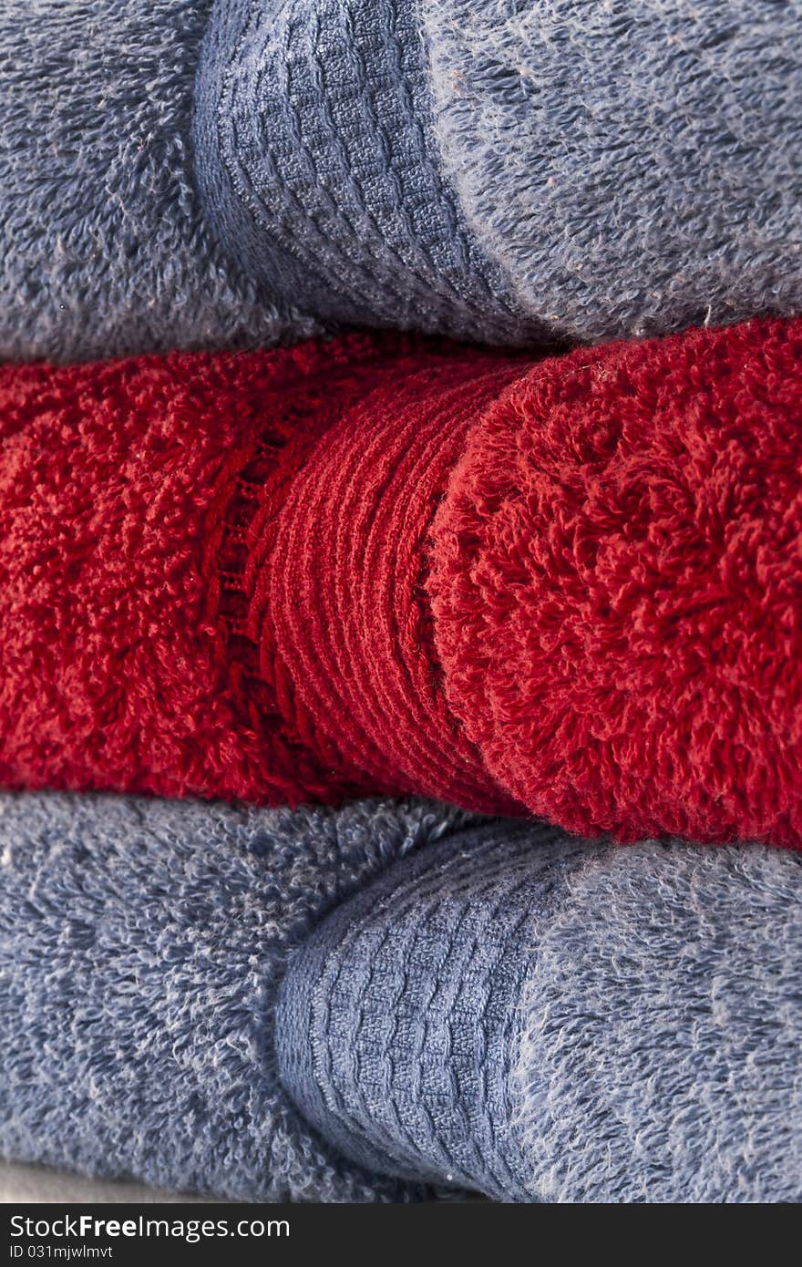 Bath towels against a white background in a studio environment. Bath towels against a white background in a studio environment