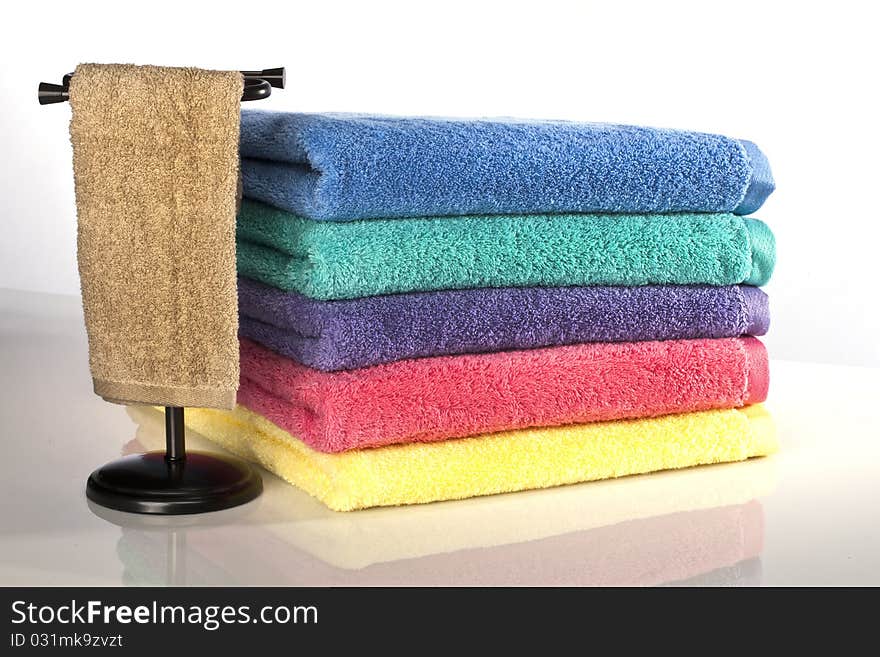 Bath towels against a white background in a studio environment. Bath towels against a white background in a studio environment