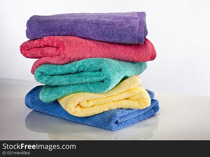 Bath towels against a white background in a studio environment. Bath towels against a white background in a studio environment