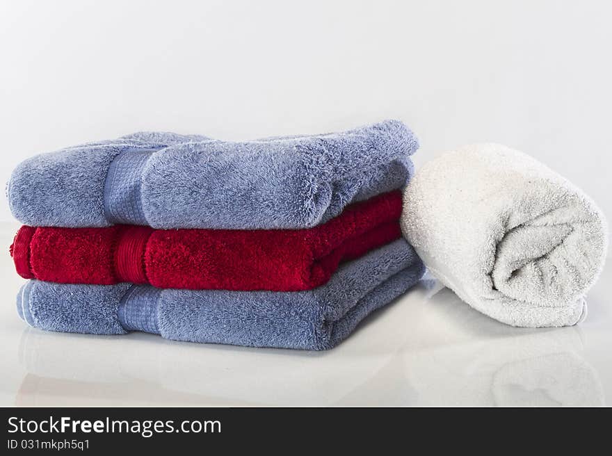 Bath towels against a white background in a studio environment. Bath towels against a white background in a studio environment