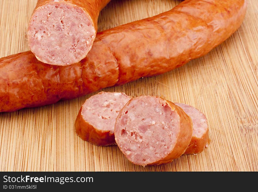 Fatty home smoked sausage on the kitchen blackboard.