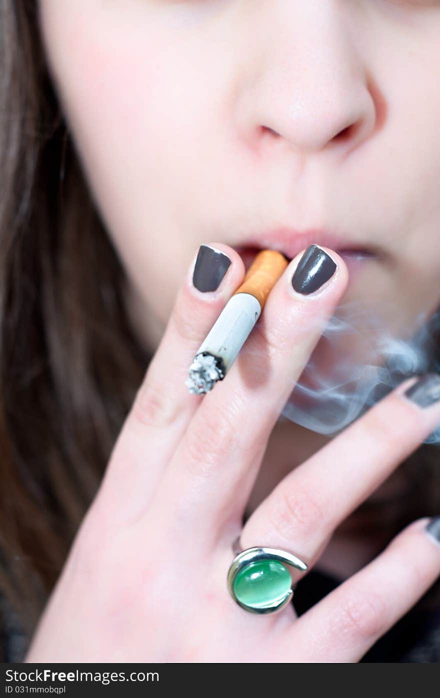 Close-up of a girl holding cigarett