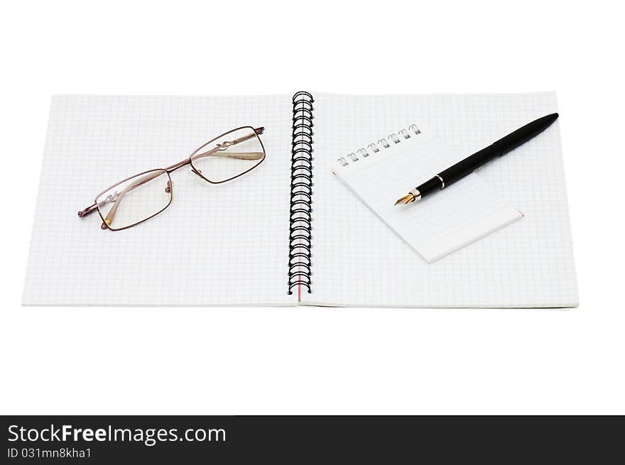 Fountain Pen and blank spiral bound notepad still life