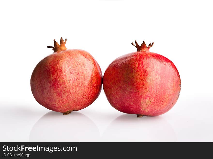 Two pomegranates on white