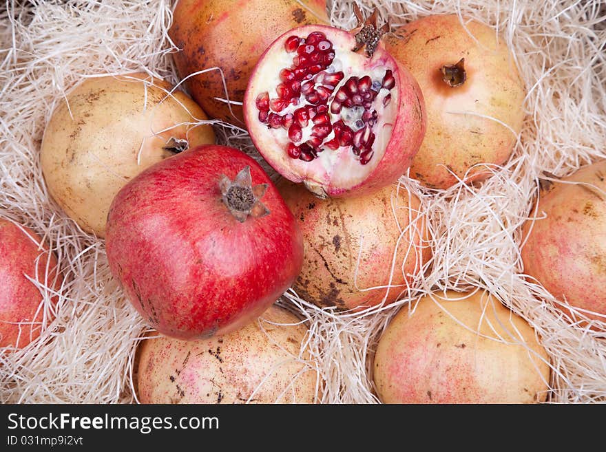 Red pomegranates in a box