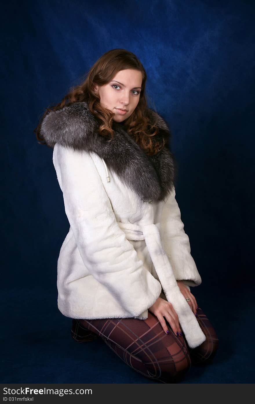 The beautiful girl in a fur fur coat