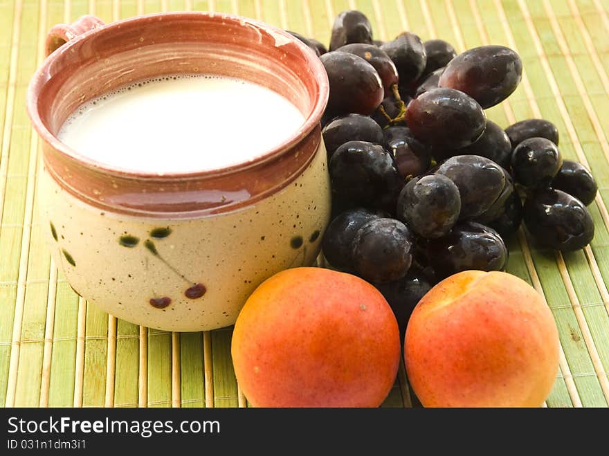 Grape apricot and cup of milk