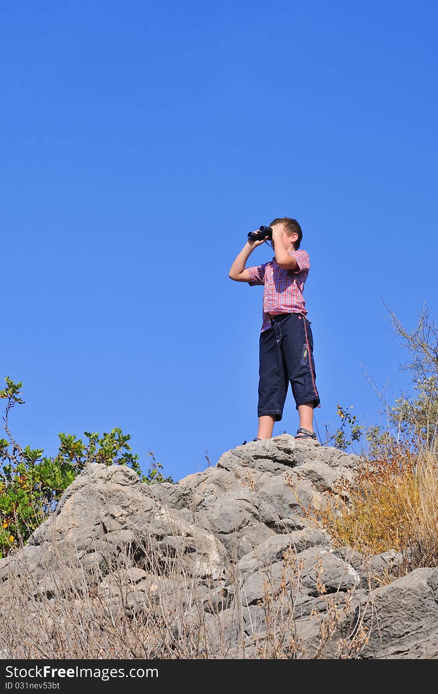 Boy with binoculars