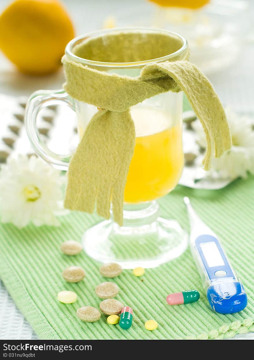 Hot drink with thermometer and pills