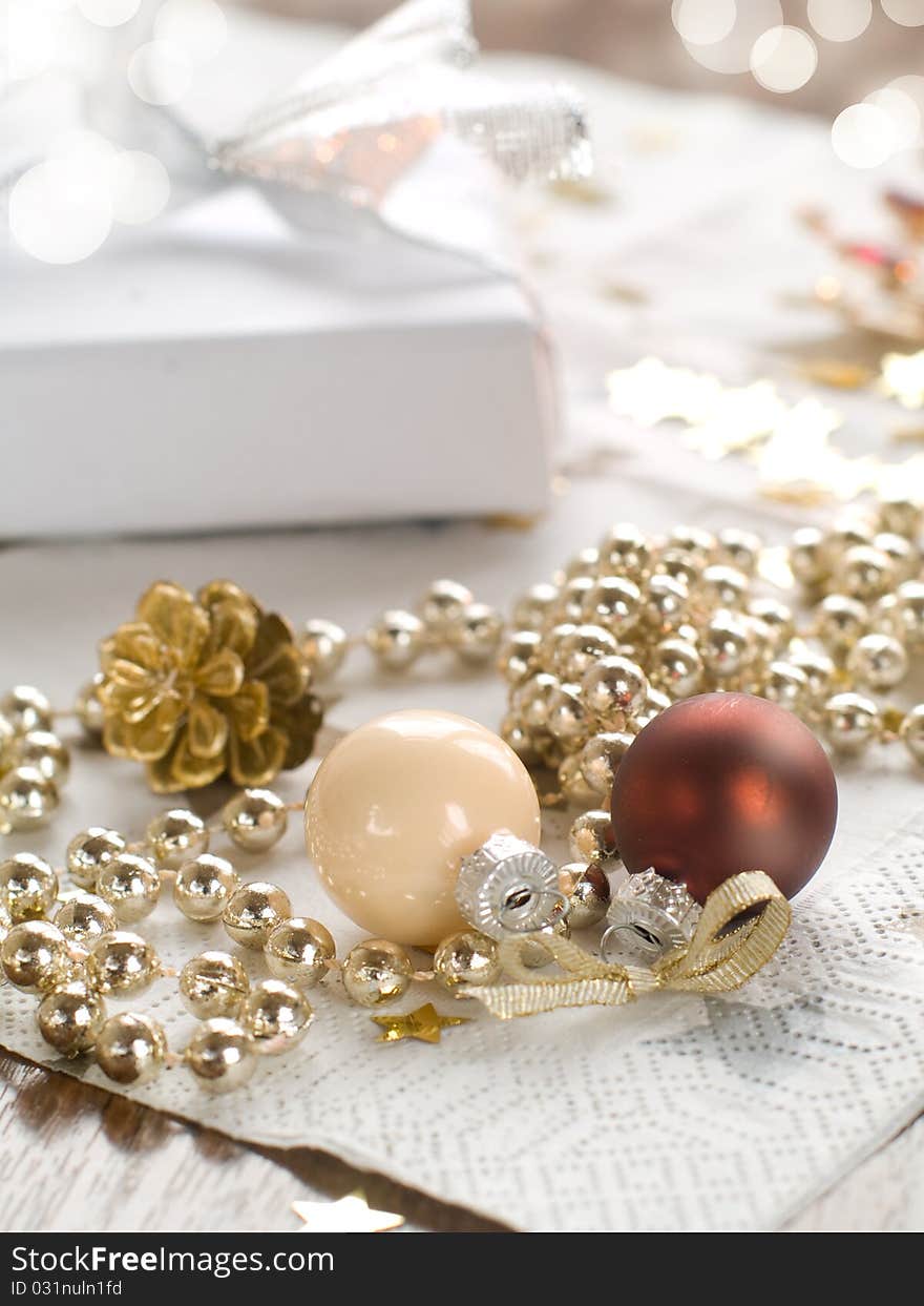 Christmas gift and baubles on light background. Christmas gift and baubles on light background