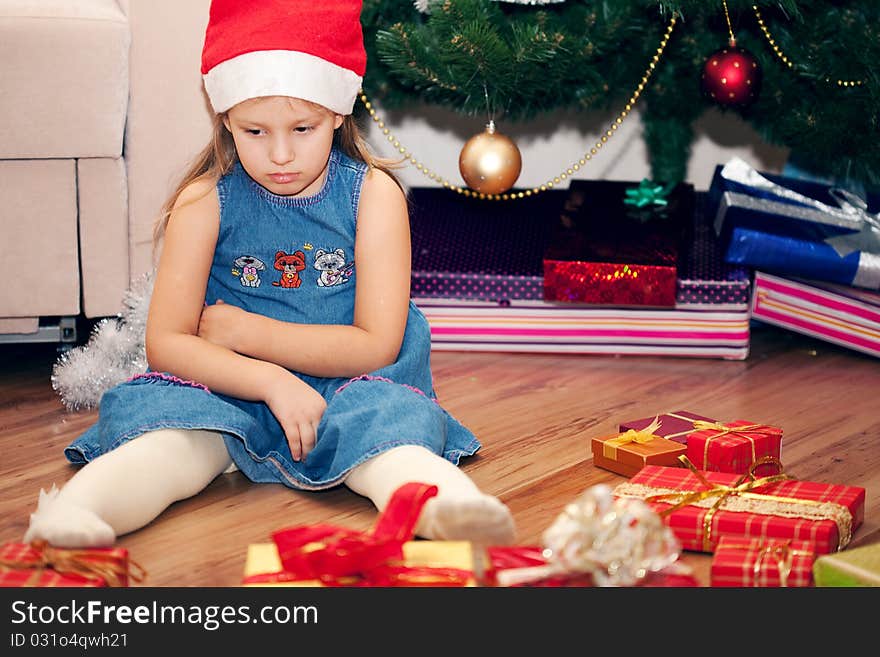 Girl is dissatisfied with the gifts. Girl is dissatisfied with the gifts