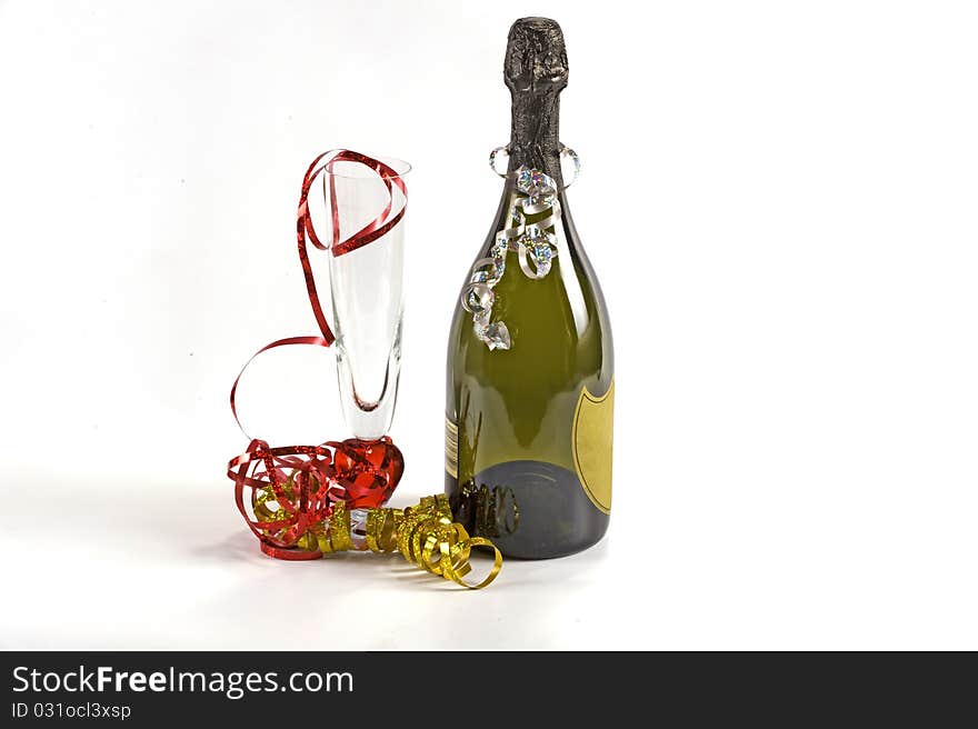 Bottle of champagne and flute glass decorated with ribbons for christmas celebration. Bottle of champagne and flute glass decorated with ribbons for christmas celebration