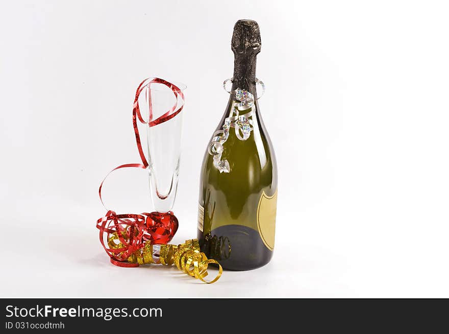 Bottle of champagne and flute  glass decorated with ribbons for christmas celebration. Bottle of champagne and flute  glass decorated with ribbons for christmas celebration