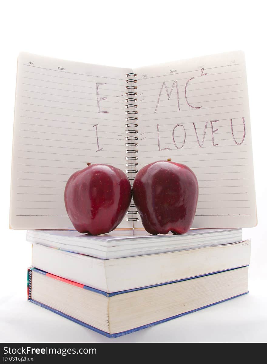 Two apple on the books isolated on white