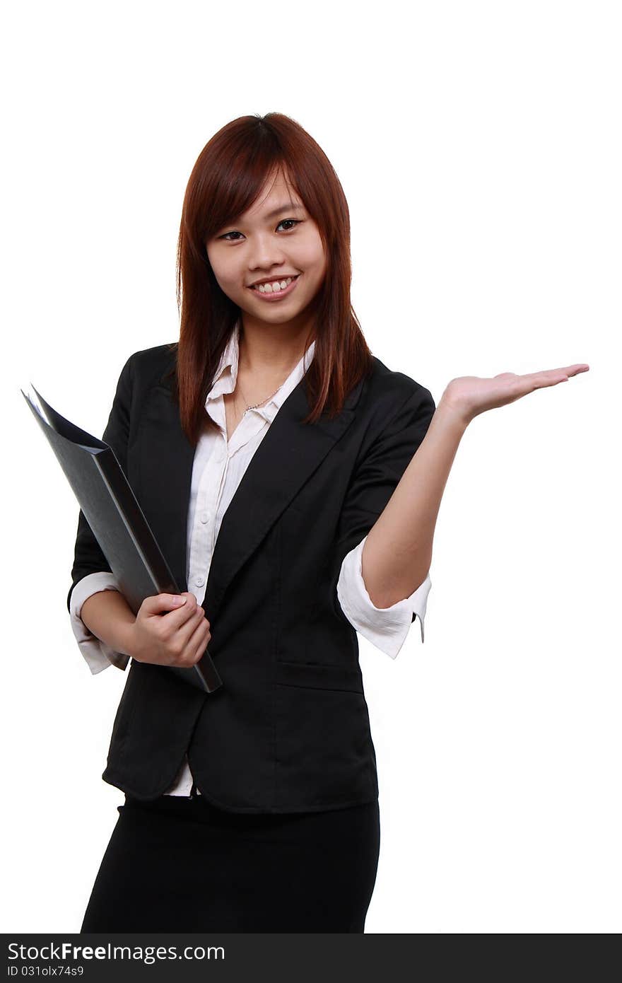 Portrait of a beautiful young business woman, holding out her hand as displaying something.