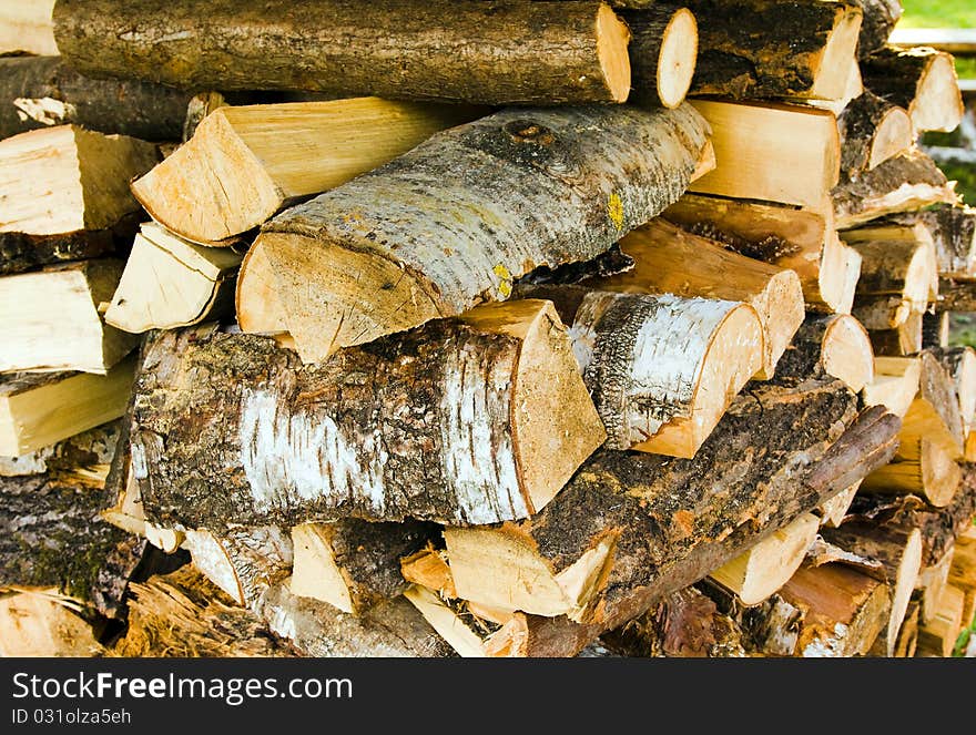 The wooden logs combined in a place for an oven kindling