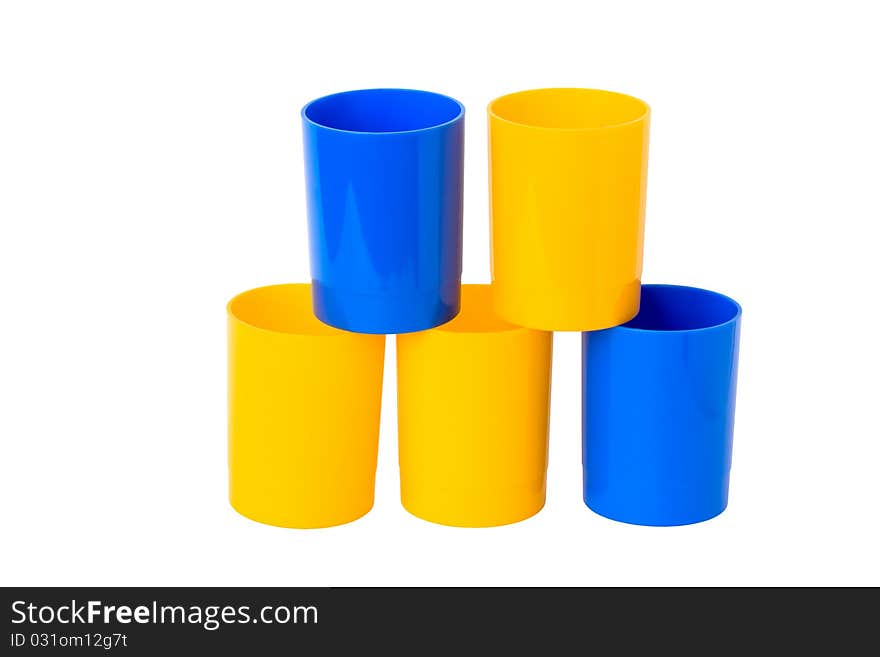 Five colored plastic cups, isolated on a white background.