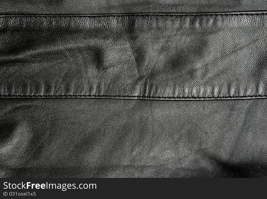 Natural black leather texture. Studio shot. Natural black leather texture. Studio shot