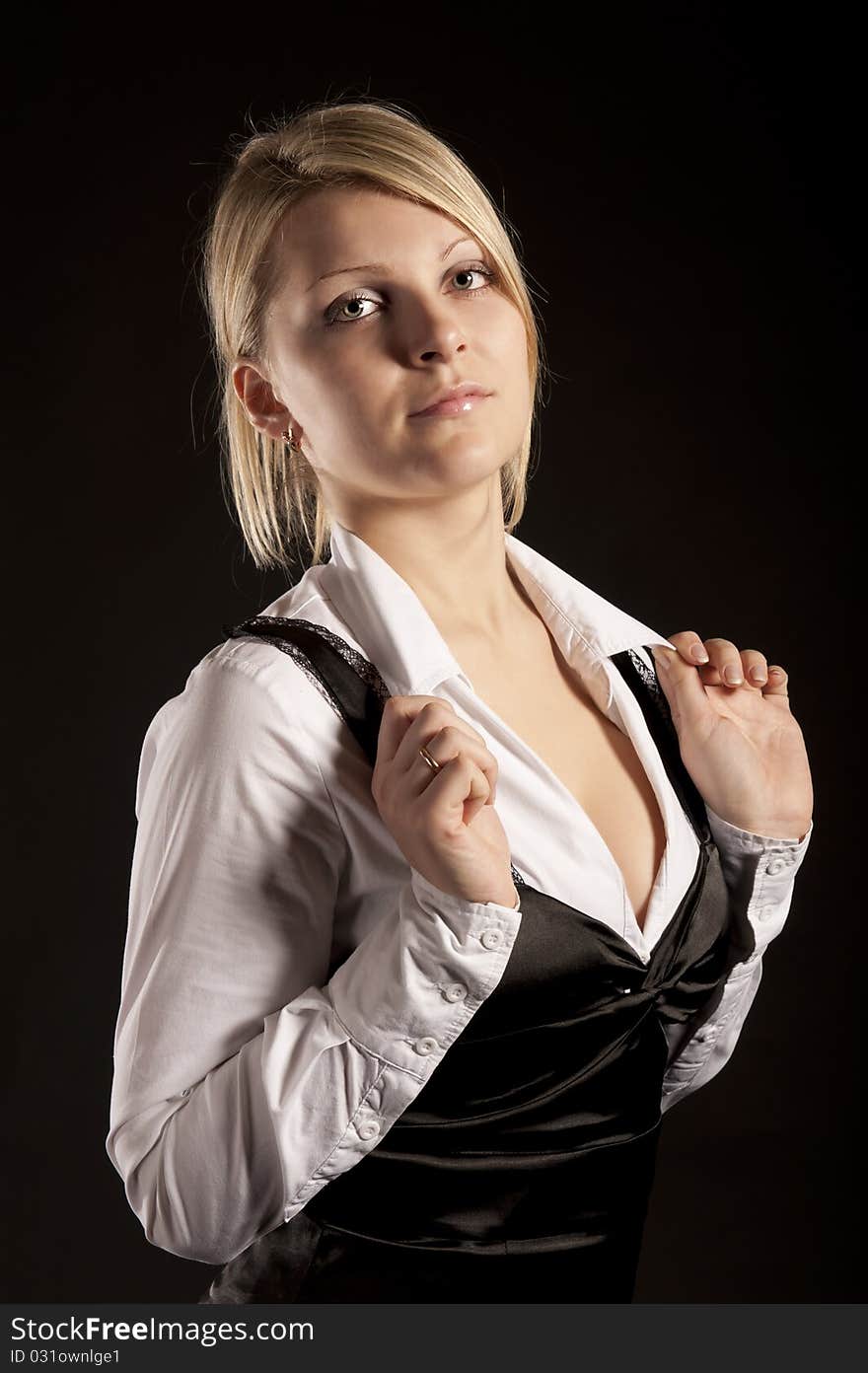 Portrait of the business woman on a black background