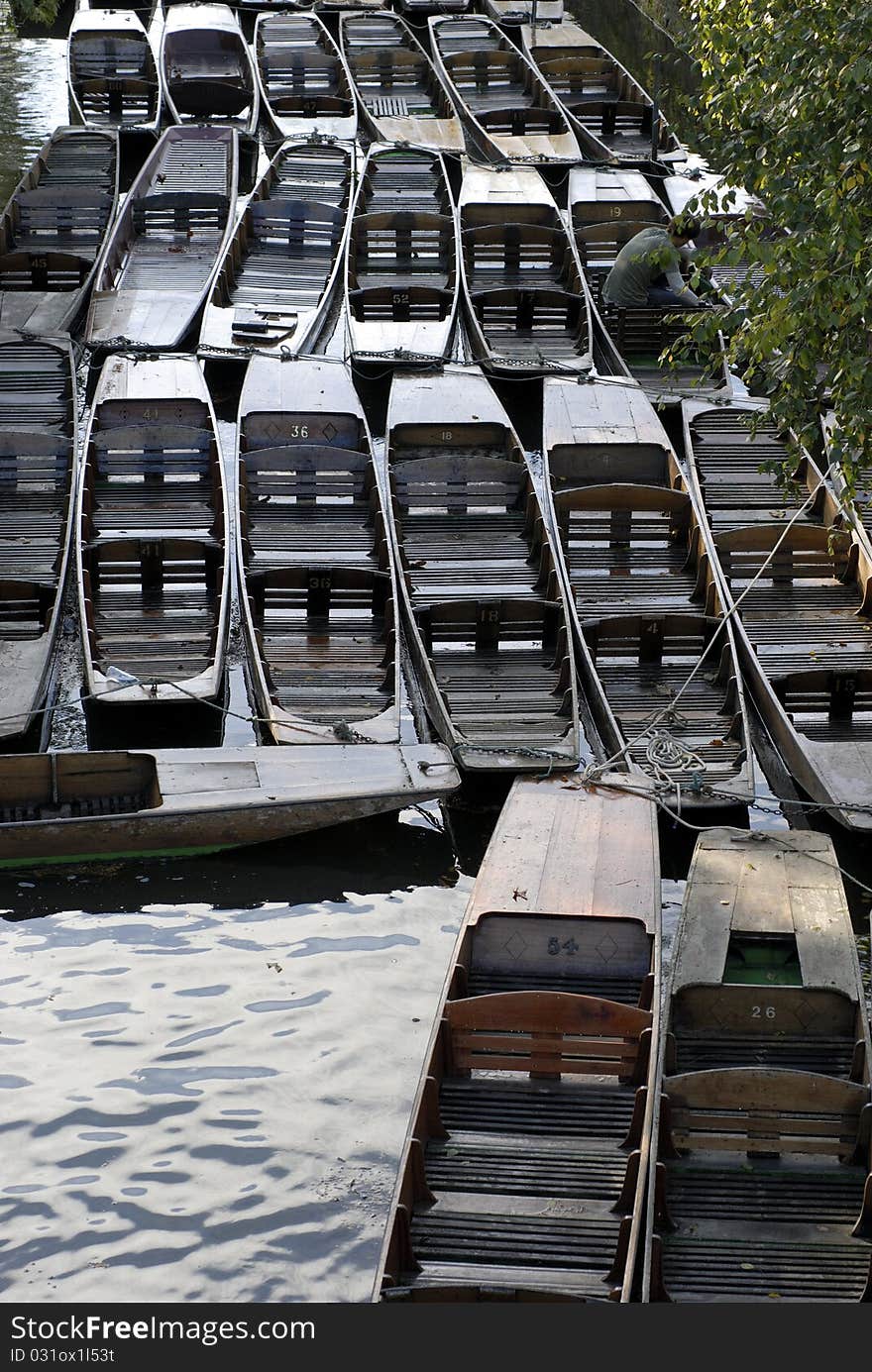 Punts moored all over in the river in Oxford, Oxfordshire, England. Punts moored all over in the river in Oxford, Oxfordshire, England.