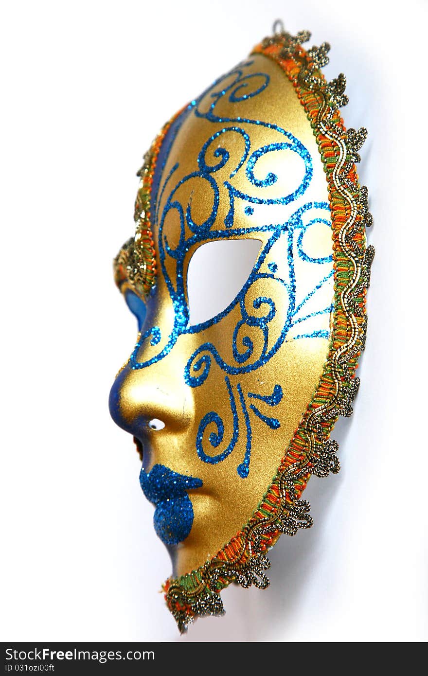 Golden blue Venitian mask on an isolated white background.