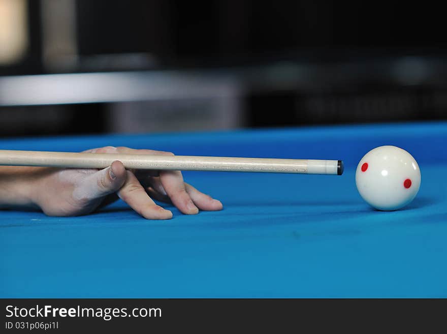 Young man play pro billiard game