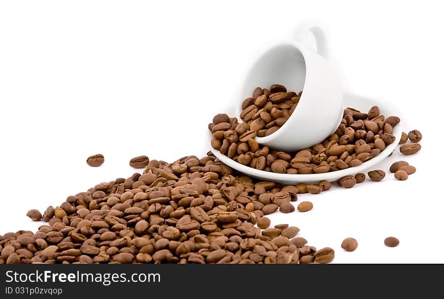 Coffee cup and grain on white background