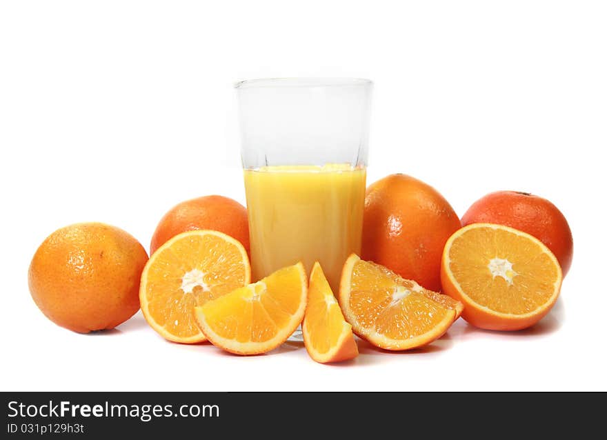 Studio photo of Oranges and glass of juice on white background. Studio photo of Oranges and glass of juice on white background