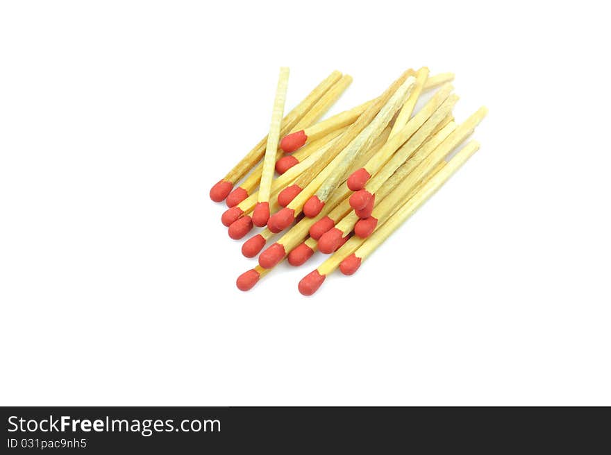 Bunch red matches close up on white background.