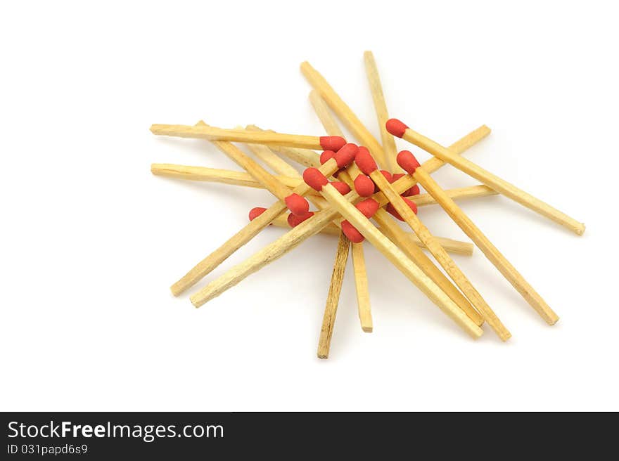 Bunch red matches close up on white background.