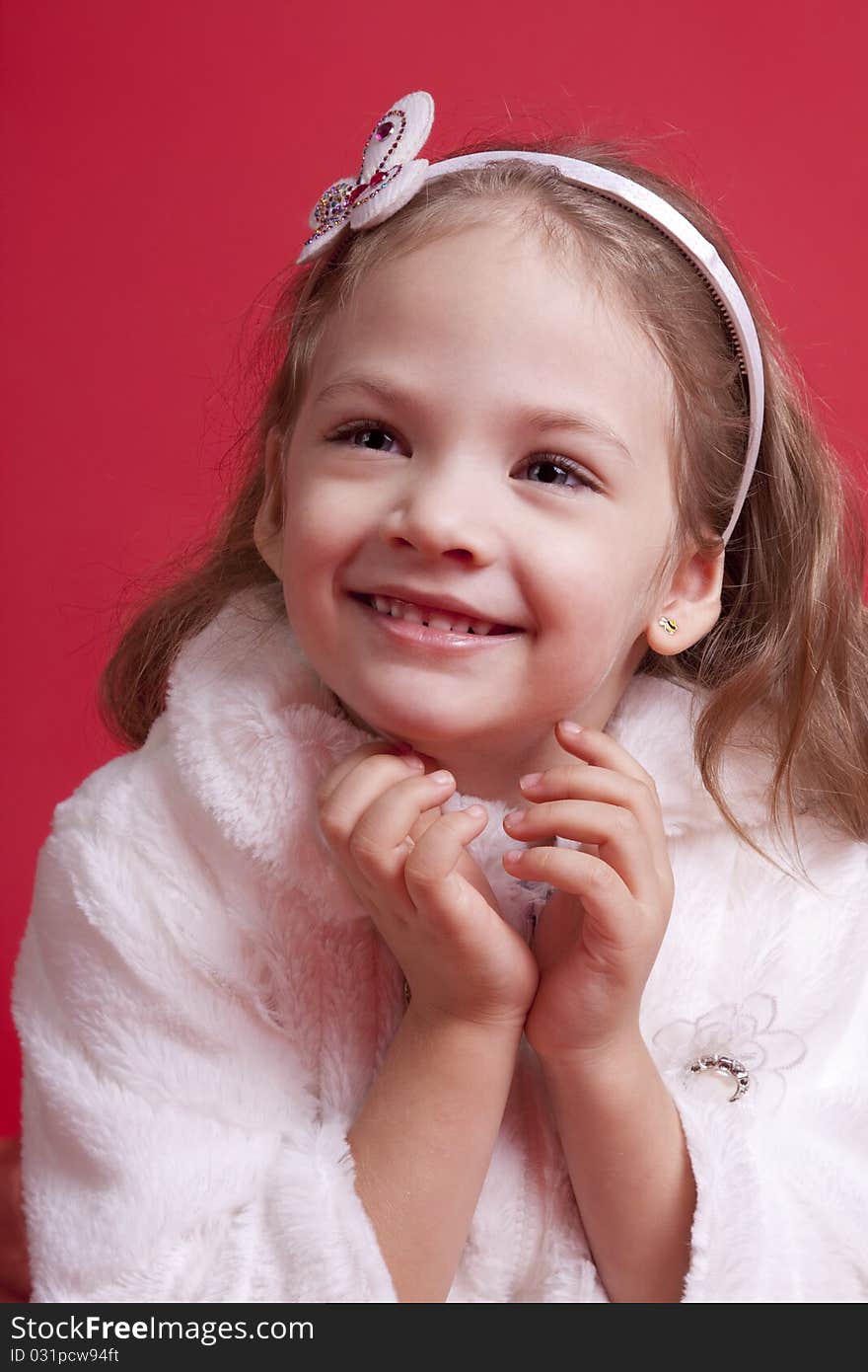 Portrait of a well-dressed cute and happy little girl. Portrait of a well-dressed cute and happy little girl